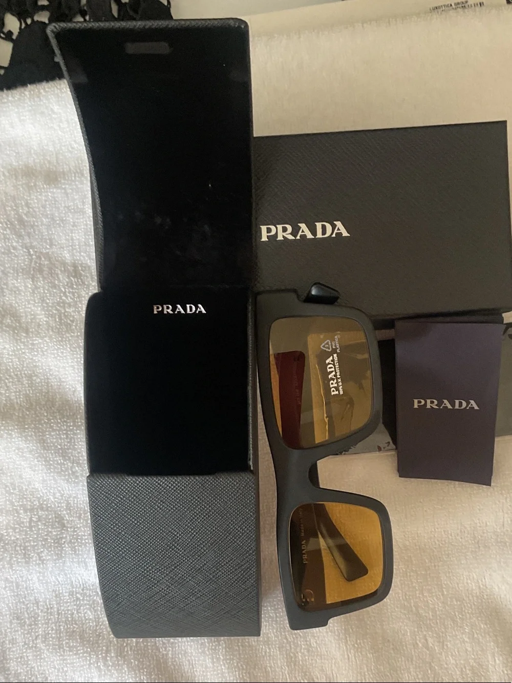 Prada Matte Black Rectangular Sunglasses with Amber Lenses